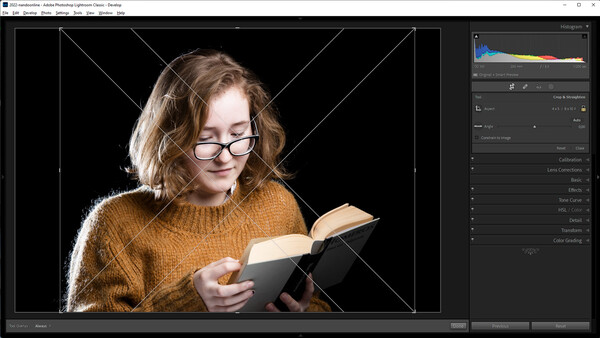 Woman wearing glasses and mustard sweater reading a book against black background with geometric overlay.
