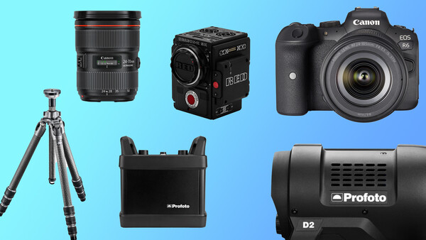 Collection of professional camera equipment including a Canon lens, cinema camera, Canon DSLR, tripod, Profoto lighting gear, and monitor on blue background.