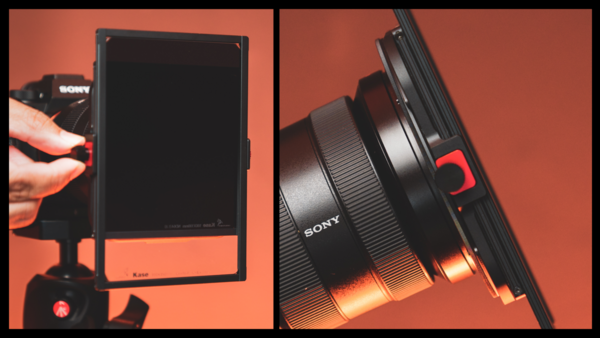 Sony monitor and lens photographed against warm orange backdrop with dramatic lighting.