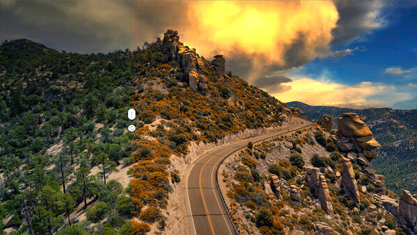 Winding mountain road with dramatic golden sunset sky and forested hillside.