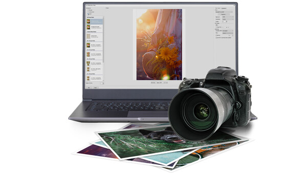 Professional DSLR camera with telephoto lens positioned next to a laptop displaying photo editing software and printed photographs.