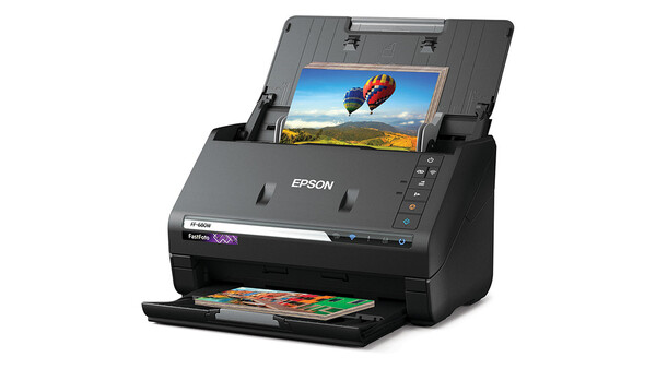 Epson FastFoto FF-640 document scanner with photo displayed on built-in preview screen.