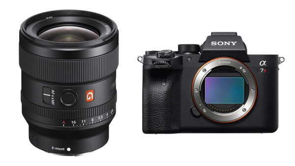Sony Alpha 7r mirrorless camera body next to a fast prime lens with autofocus motor.