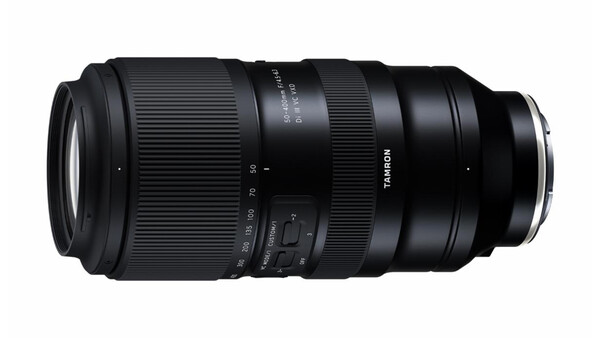 Tamron telephoto zoom lens with ribbed rubber focus and zoom rings against a white background.