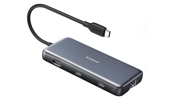 USB-C hub with multiple ports and attached cable against white background.