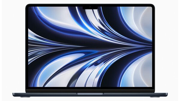 Screenshot of a laptop displaying an abstract digital wallpaper with flowing blue and white curved lines.