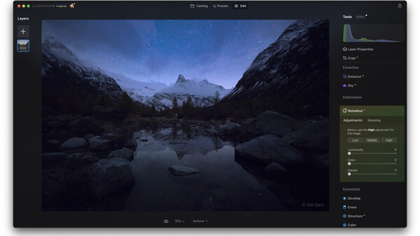 Screenshot of photo editing software showing a nighttime mountain landscape with reflective water.
