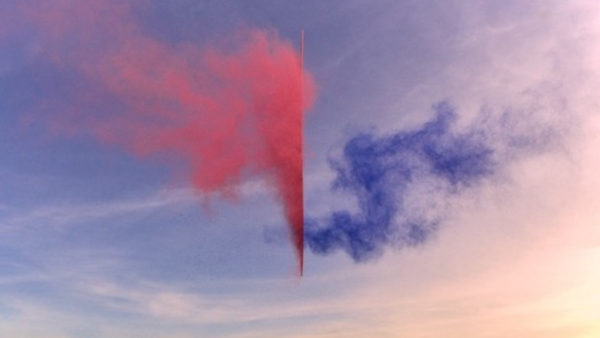 Red and blue smoke clouds dispersing against a pastel sunset sky.