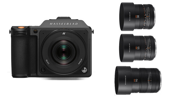 Hasselblad 907X camera body with three interchangeable lenses displayed on white background.