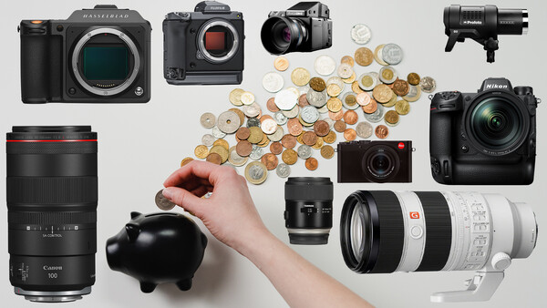 Photography equipment collection displayed flat lay with coins pouring from piggy bank.