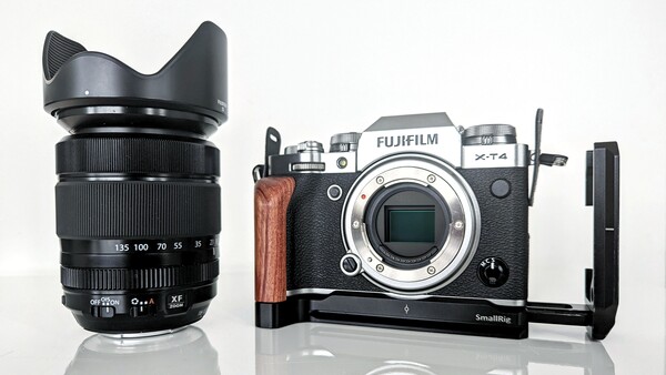 Fujifilm X-T4 mirrorless camera body with lens and SmallRig L-bracket on white background.