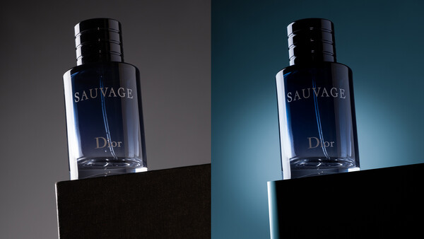 Dior Sauvage fragrance bottle photographed against contrasting gray and teal backgrounds.