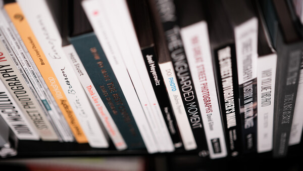 Collection of DVDs and Blu-ray cases arranged in a row, showing various film spines and titles.