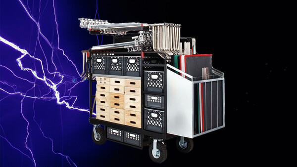 Illustration of a mobile equipment cart with modular storage compartments and a lightning bolt graphic on dark background.