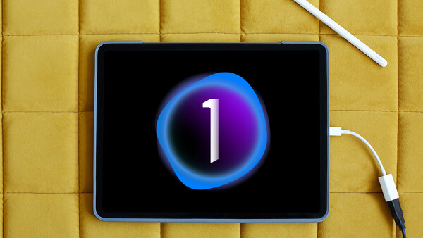 Tablet displaying a glowing blue and purple circular countdown timer showing the number 1 against a black background.