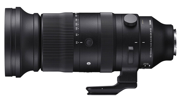 Black telephoto lens with tripod collar and focus ring against white background.
