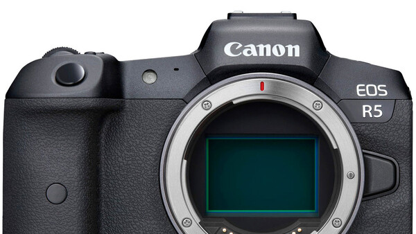 Canon EOS R5 mirrorless camera body shown from front with sensor visible through open mount.