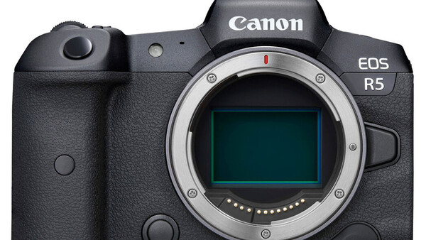 Canon EOS R5 mirrorless camera body shown from front, displaying the sensor and mount without a lens attached.