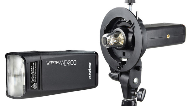 Godox Witstro AD200 compact flash unit and mounting bracket with reflector displayed side by side.