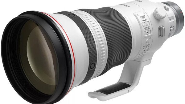 White telephoto zoom lens with large front element and integrated tripod collar.