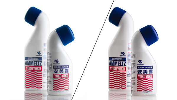 Two product comparison shots of cleaning bottles with blue caps and red wavy label designs, shown side-by-side.