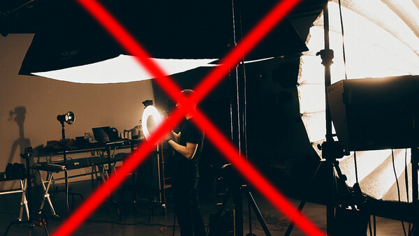 Studio setup with red X overlay across lighting equipment and workspace.