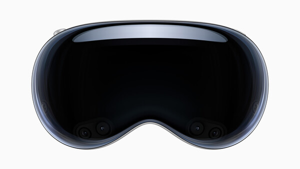 Front view of a spatial computing headset with a curved display and dark lens area.