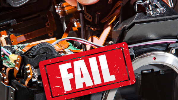 Red FAIL stamp overlaid on internal circuitry and mechanical components of an electronic device.