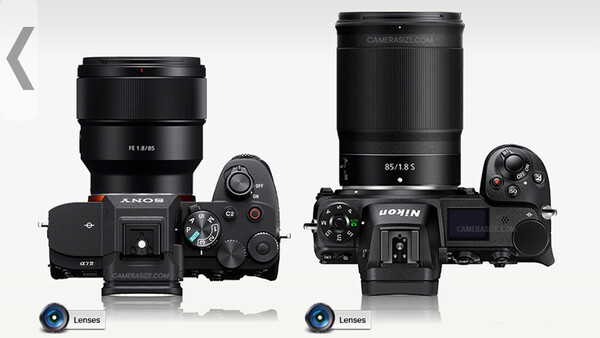 Comparison of two mirrorless camera systems with lenses mounted, shown from above against a white background.