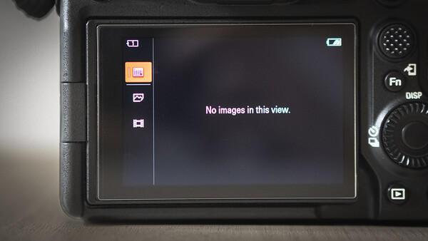 Screenshot of a digital camera's LCD screen displaying an empty gallery view with "No images in this view" message.