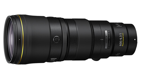 Black telephoto lens with gold accents and focal length marking on barrel.