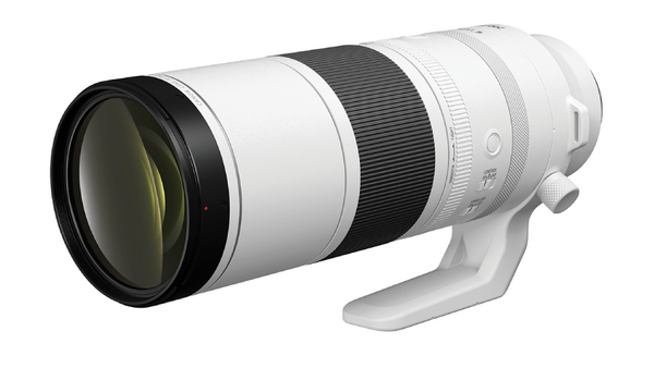White telephoto lens with black front element and focus ring, shown at three-quarter angle against white background.