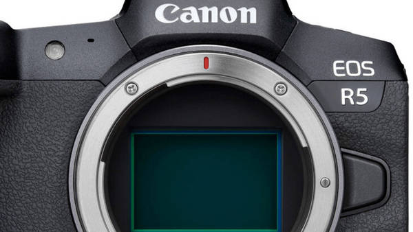 Canon EOS R5 mirrorless camera body shown from front, displaying the mount and sensor area.