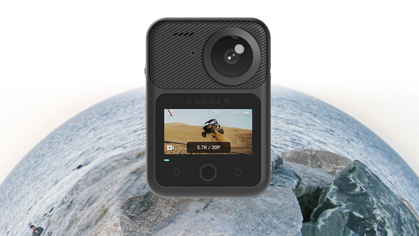 Action camera with flip-out screen displaying 5.7K video resolution mounted on Earth globe.
