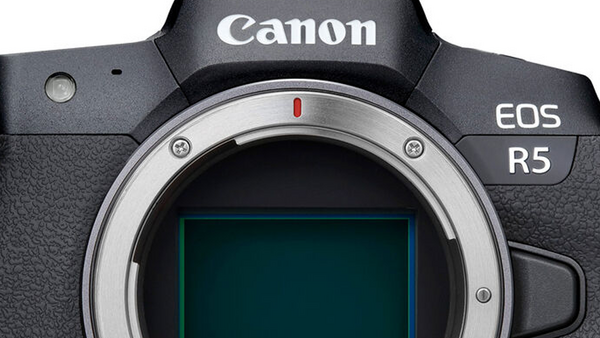 Canon EOS R5 mirrorless camera body front view showing lens mount and sensor.
