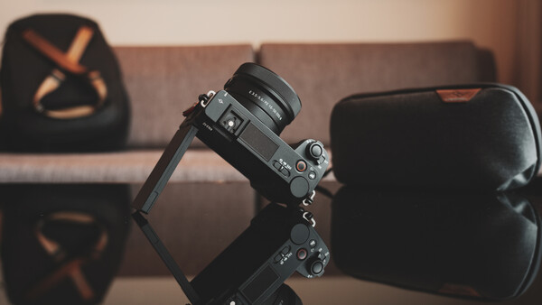 Sony mirrorless camera mounted on a gimbal stabilizer in an indoor studio setting.