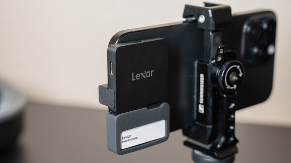 Lexar smartphone mount attached to a camera rig with telephoto lens.