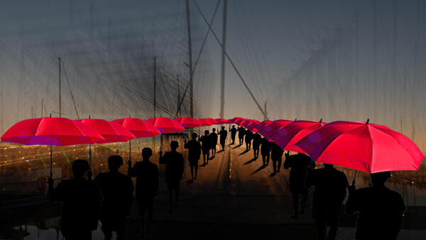 Silhouetted crowd holding bright red umbrellas on a wet bridge at dusk.