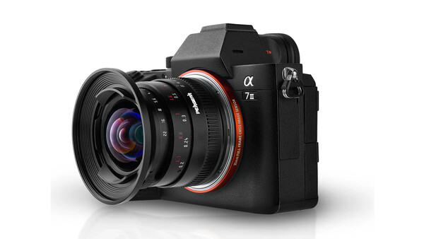Sony α7R mirrorless camera with wide-angle lens attached, shown against white background.