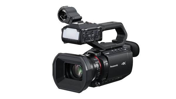 Panasonic 4K professional camcorder with flip-out monitor and shoulder-mounted viewfinder.