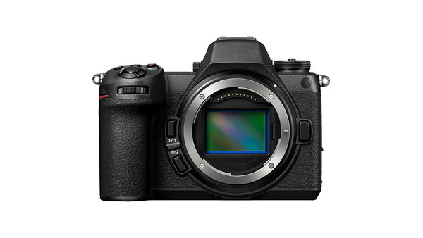 Mirrorless camera with black textured body displayed front-on, showing open sensor with rainbow gradient reflection.