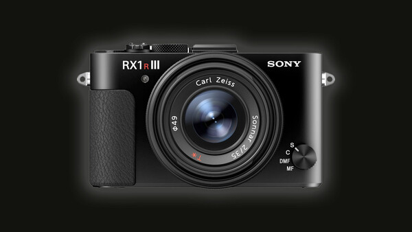 Sony RX1R III compact camera with fixed Carl Zeiss lens against dark background.