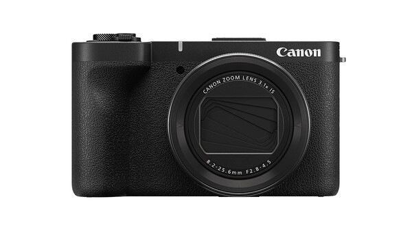 Canon compact digital camera with black textured grip and fixed zoom lens against white background.