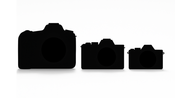 Silhouette illustration showing three DSLR cameras in decreasing sizes from left to right.