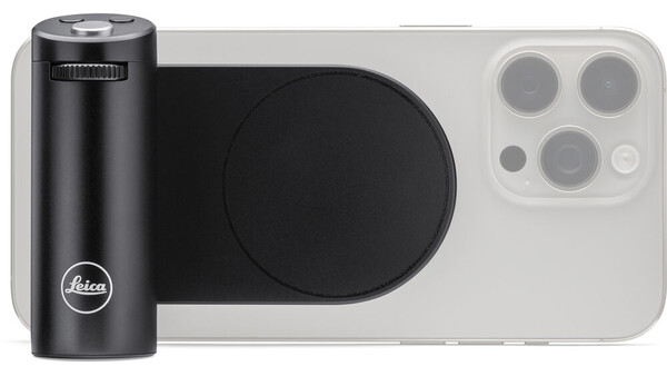 Leica smartphone camera grip mounted on iPhone 14 Pro with black cylindrical lens attachment.
