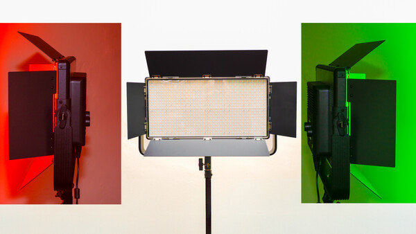 Three studio LED panel lights shown from the side with wings open, illuminated against red, neutral, and green backgrounds.