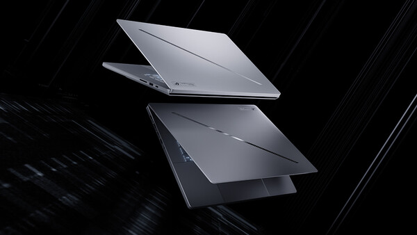 Two laptops displayed at angles against a dark background with diagonal light streaks.