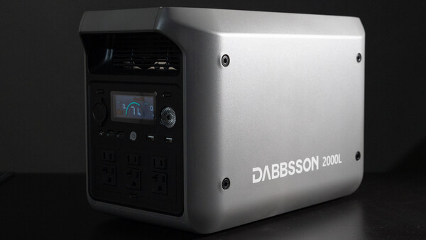 Dabbsson 2000L portable power station with white exterior and black control panel featuring small LCD display.