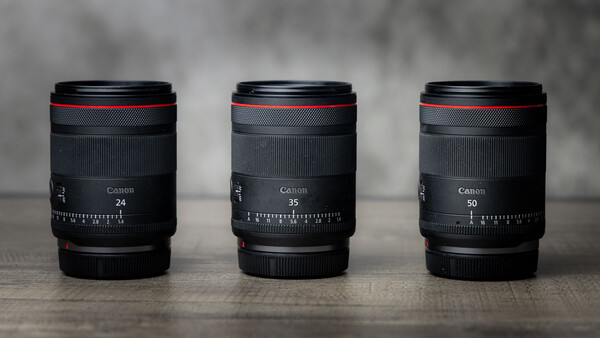 Three Canon RF mount lenses displayed side by side showing 24mm, 35mm, and 50mm focal lengths.