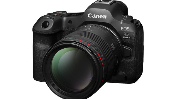 Canon EOS R5 Mark II mirrorless camera with attached telephoto lens against white background.